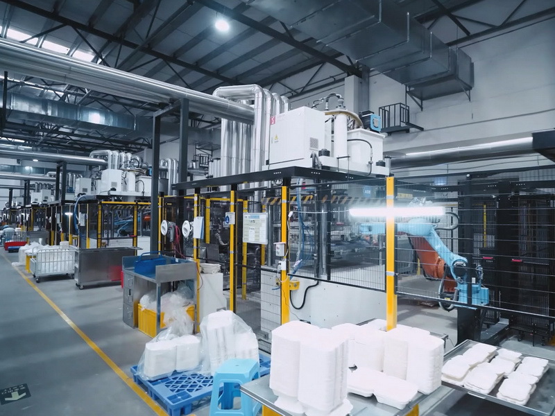Automated bagasse tableware production line with robotic arms