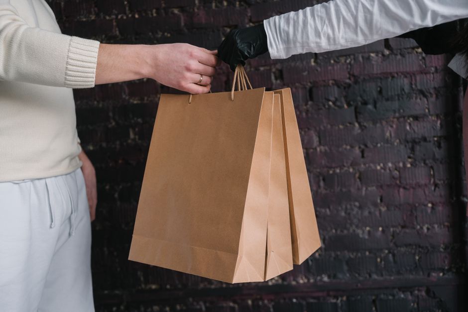 What is the difference between compostable film and wax coating for food packaging?